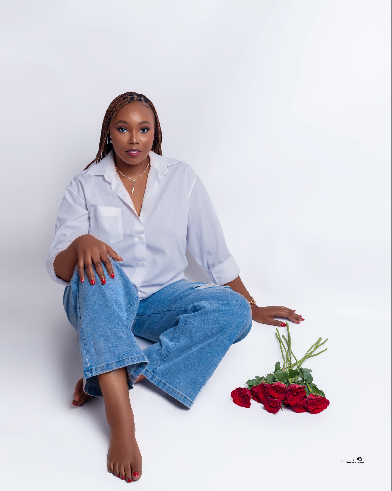 Editorial studio portrait with red roses